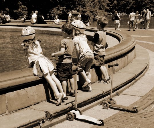 Four children gather at the Bethesda Fountain in Central Park